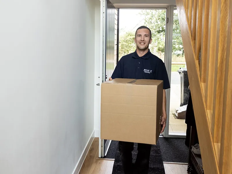 move-it-mover-boxes Move It team carrying boxes into a new-build home at Runwell